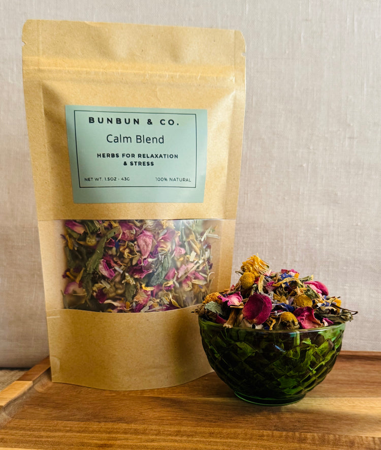 Bunbun & Co. Calm Blend rabbit forage package with a bowl of forage on a wooden surface.