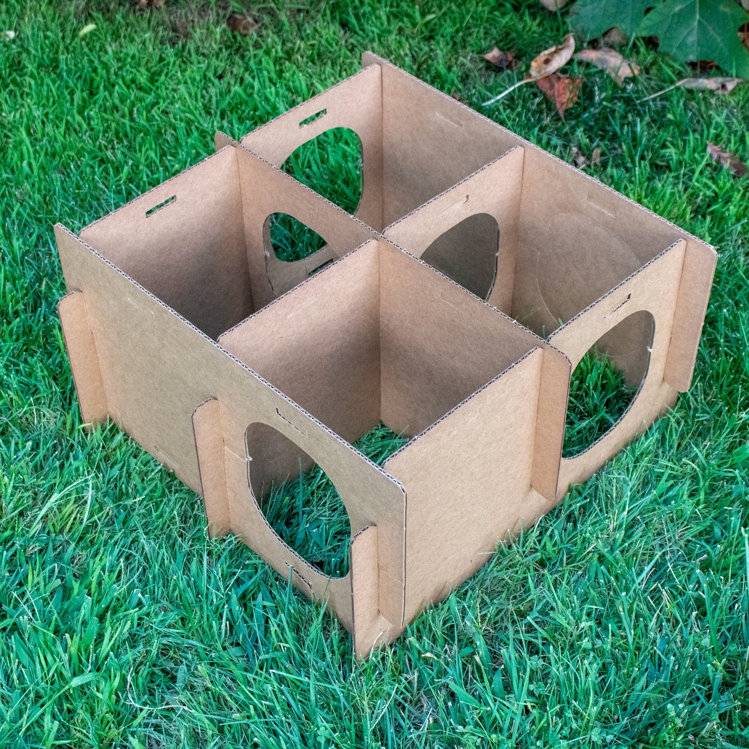Assembling of cardboard bunny maze enrichment house with multiple round entrances