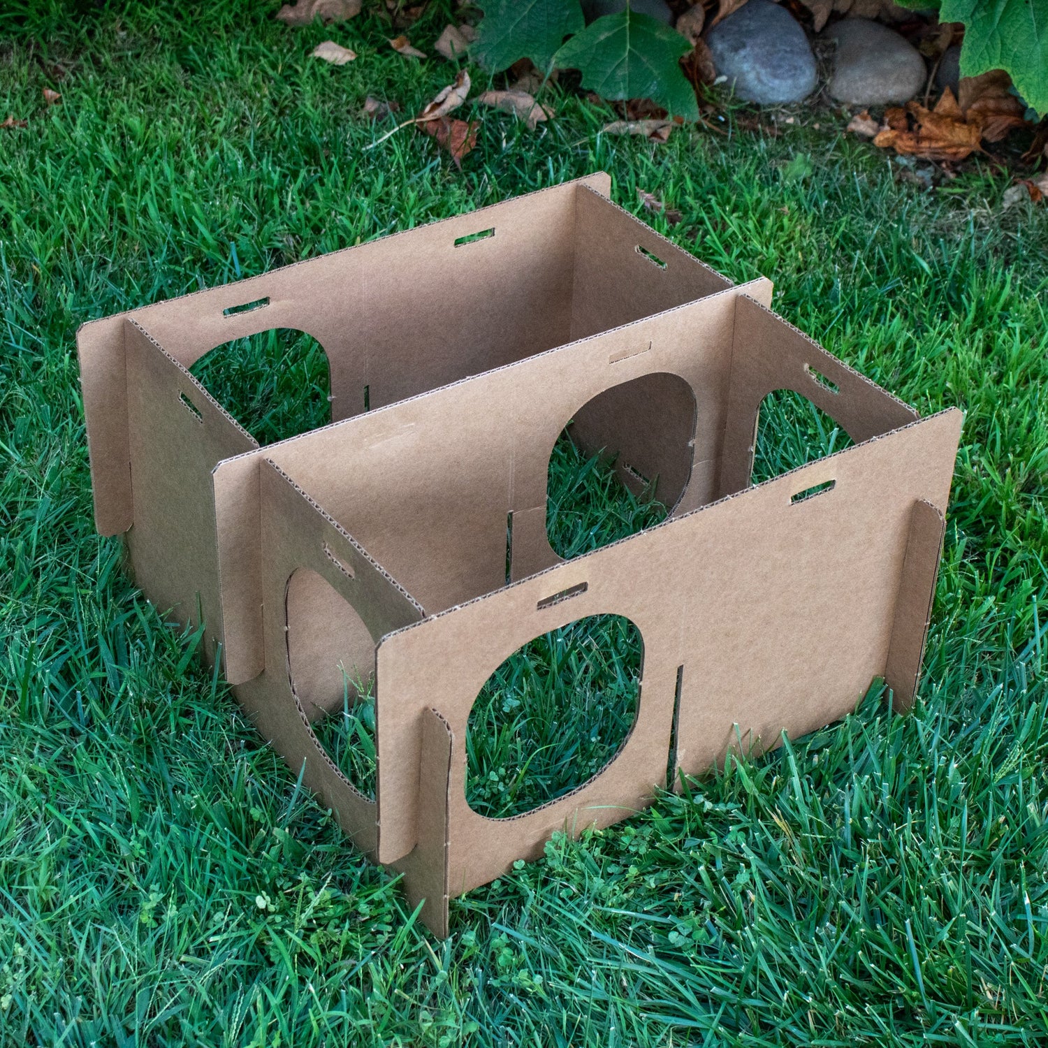 Assembling of cardboard bunny maze enrichment house with multiple round entrances
