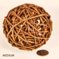 Medium natural willow enrichment chew ball for rabbits with coin beside it for scale