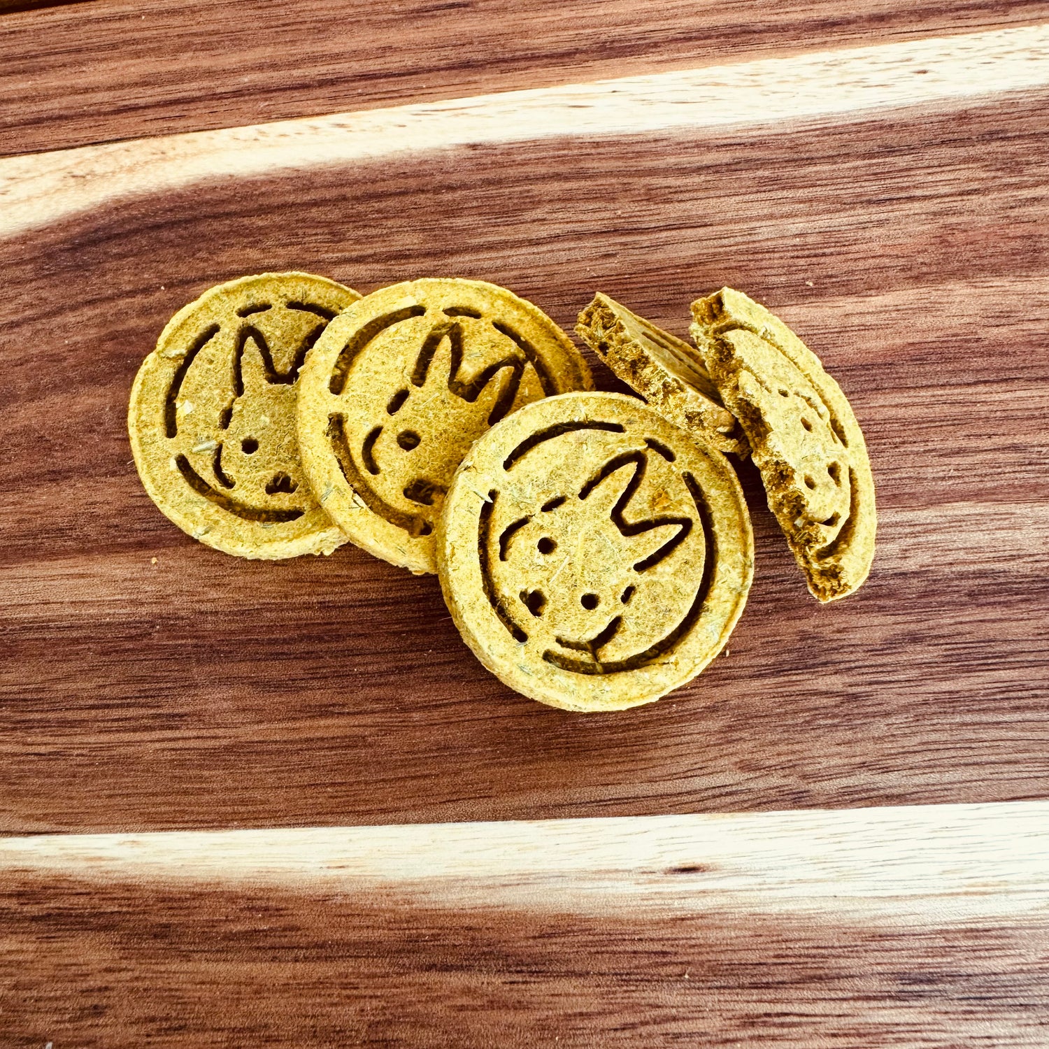 Pumpkin and sage botanical rabbit biscuit from BunBun & Co Cognitive Support Blend with broken biscuit to show texture.
