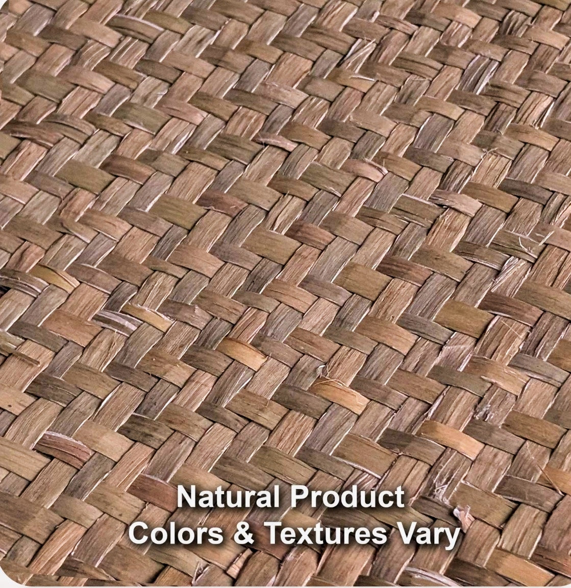 Close view of woven natural seagrass mat texture showing color and weave variation