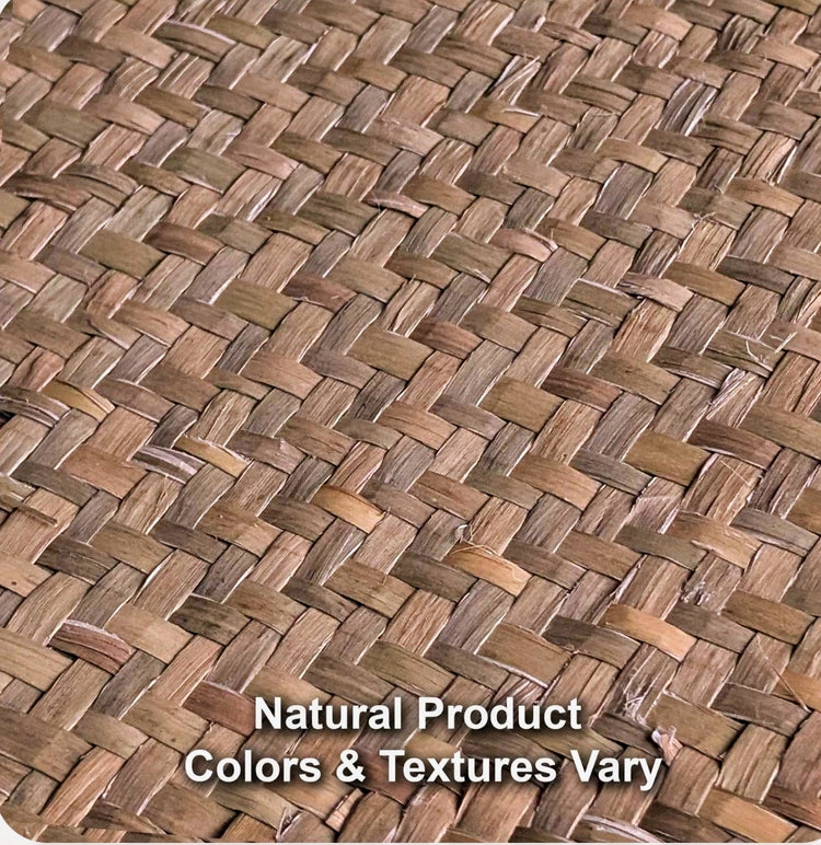 Close view of woven natural seagrass mat texture showing color and weave variation