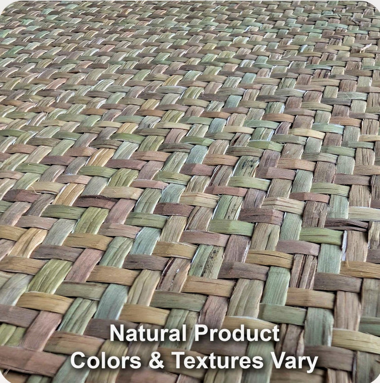 Close view of woven natural seagrass mat texture showing color and weave variation