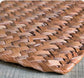 Detailed texture of natural fiber rabbit mat showing woven seagrass strands