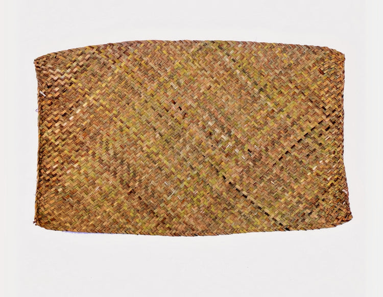 Natural woven seagrass mat for rabbits displayed on white background