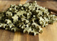 Star-shaped green  rabbit treats on a wooden surface