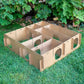 Large Maze Haven cardboard rabbit maze playhouse showing interior compartments and entrances on grass
