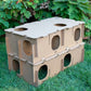 Stacked Large Maze Haven cardboard rabbit hide maze showing multi-level playhouse design on grass