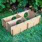 Large Maze Haven cardboard rabbit maze base showing open interior compartments on grass